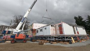 Modular housing being craned in